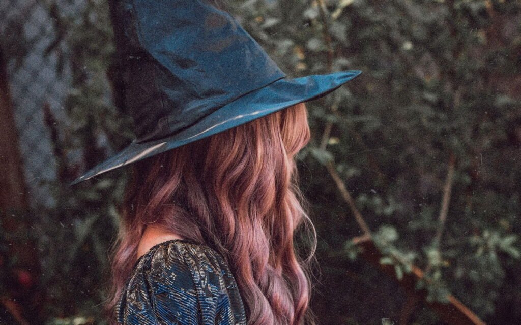 Brunette girl with witch hat