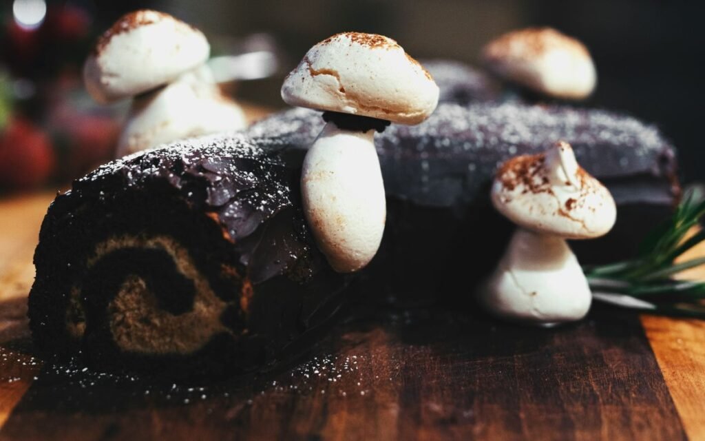 A wooden chocolate cake with white cream feeling and fake mushroom decorations